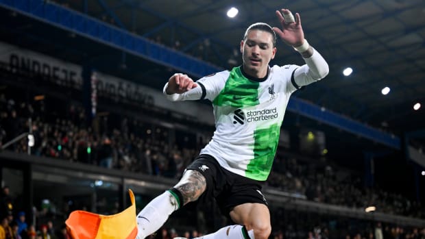 Darwin Nunez pictured celebrating by kicking the corner flag after scoring two goals for Liverpool in a 5-1 win over Sparta Prague in March 2024